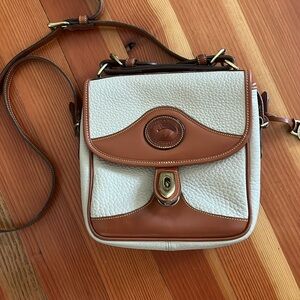 Dooney and Bourke bag with removable strap and inside zip pocket.